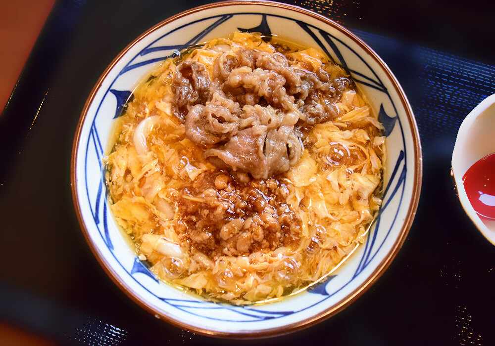 丸亀製麺「肉がさね玉子あんかけうどん」